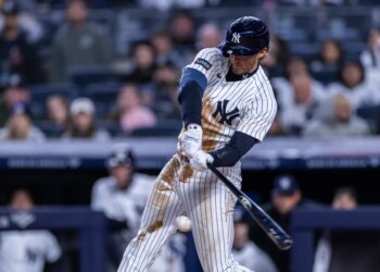 Yankees third baseman Ryan McMahon (19) reaches first base on an error during the third inning against the Miami Marlins at Yankee Stadium, Saturday, April 4, 2026, in Bronx, NY.