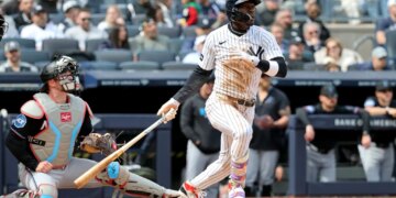 New York Yankees second baseman Jazz Chisholm Jr. (13) hits a double.