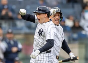 New York Yankees first baseman Ben Rice (22) celebrates with New York Yankees right fielder Aaron Judge (99) after he scores on his solo homer.