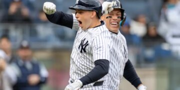 New York Yankees first baseman Ben Rice (22) celebrates with New York Yankees right fielder Aaron Judge (99) after he scores on his solo homer.