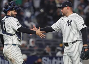 David Bednar celebrates with Austin Wells after closing out the Yankees' 5-3 comeback win over the A's on April 7, 2026 at the Stadium.