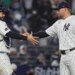 David Bednar celebrates with Austin Wells after closing out the Yankees' 5-3 comeback win over the A's on April 7, 2026 at the Stadium.