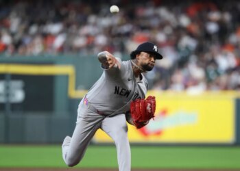 Yankees starting pitcher Luis Gil (81) delivers a pitch during the second inning against the Houston Astros at Daikin Park.