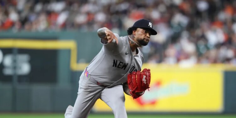 Yankees starting pitcher Luis Gil (81) delivers a pitch during the second inning against the Houston Astros at Daikin Park.