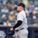 New York Yankees pitcher Ryan Weathers walks towards the dugout after the third inning.