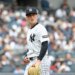 New York Yankees pitcher Will Warren (29) reacts as he walks back to the dugout after ending the first inning.
