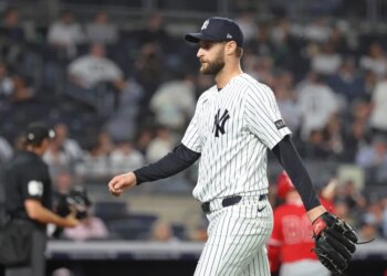 New York Yankees pitcher Jake Bird #59 reacts as he walks back to the dugout after ending the 6th inning.