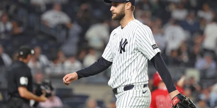 New York Yankees pitcher Jake Bird #59 reacts as he walks back to the dugout after ending the 6th inning.