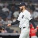 New York Yankees pitcher Jake Bird #59 reacts as he walks back to the dugout after ending the 6th inning.