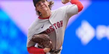 Boston Red Sox pitcher Connelly Early delivering a pitch.