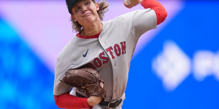 Boston Red Sox pitcher Connelly Early delivering a pitch.
