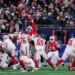 New York Giants kicker Younghoe Koo (37) kicks during the first half of an NFL football game against the New England Patriots.
