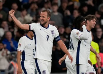 England's Harry Kane celebrating his team's second goal with teammates during a UEFA Nations League soccer match.