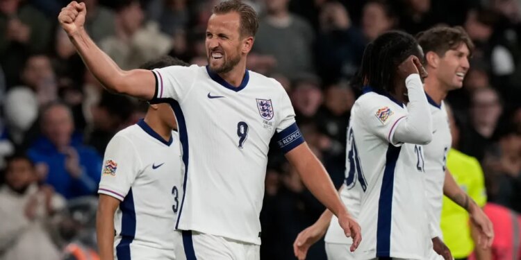 England's Harry Kane celebrating his team's second goal with teammates during a UEFA Nations League soccer match.