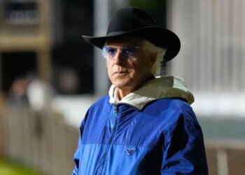 Trainer Bob Baffert in a cowboy hat and sunglasses.