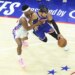 New York Knicks guard Jalen Brunson #11 drives to the basket as Philadelphia 76ers guard Vj Edgecombe #77 gives chase.