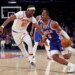 Philadelphia 76ers guard Tyrese Maxey #0 drives to the basket as New York Knicks center Ariel Hukporti #55 gives chase in the second quarter.