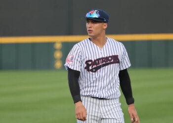 Somerset Patriots player Anthony Volpe #7 warming up on the field.
