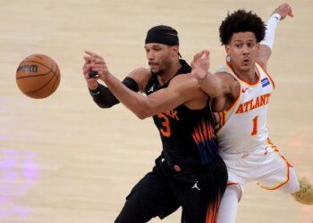 Atlanta Hawks forward Jalen Johnson (1) defends an in-bounds pass to New York Knicks guard Josh Hart (3) during the first quarter of game five of the first round of the 2026 NBA Playoffs at Madison Square Garden.