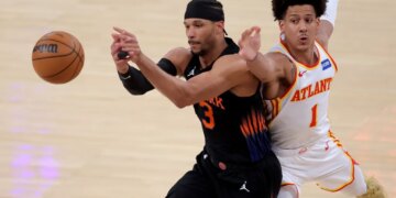 Atlanta Hawks forward Jalen Johnson (1) defends an in-bounds pass to New York Knicks guard Josh Hart (3) during the first quarter of game five of the first round of the 2026 NBA Playoffs at Madison Square Garden.