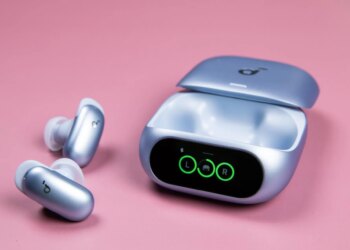 The blue Soundcore Liberty 5 Pro earbuds sitting next to their open case on a mauve background.