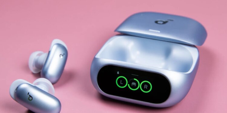 The blue Soundcore Liberty 5 Pro earbuds sitting next to their open case on a mauve background.