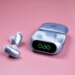 The blue Soundcore Liberty 5 Pro earbuds sitting next to their open case on a mauve background.