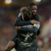 Khvicha Kvaratskhelia embraces Ousmane Dembele after Dembele scored a goal.