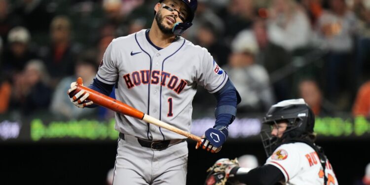 Houston Astros' Carlos Correa (1) reacts after striking out during the seventh inning of a baseball game against the Baltimore Orioles, Tuesday, April 28, 2026, in Baltimore.