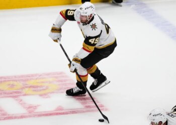Vegas Golden Knights left wing Ivan Barbashev shoots an empty-net goal during the third period in Game 2 of the Western Conference finals NHL hockey Stanley Cup playoff series against the Colorado Avalanche, Friday, May 22, 2026, in Denver. (AP Photo/David Zalubowski)