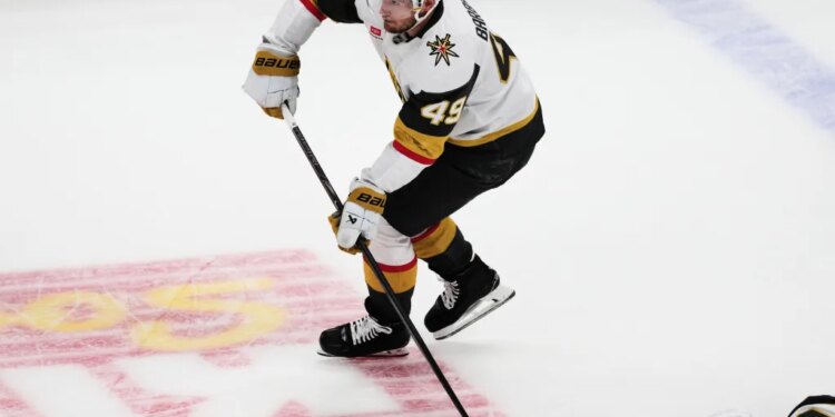 Vegas Golden Knights left wing Ivan Barbashev shoots an empty-net goal during the third period in Game 2 of the Western Conference finals NHL hockey Stanley Cup playoff series against the Colorado Avalanche, Friday, May 22, 2026, in Denver. (AP Photo/David Zalubowski)