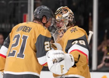 Vegas Golden Knights center Brett Howden, left, and goaltender Carter Hart congratulate each other after the Golden Knights defeated the against the Colorado Avalanche in Game 3 of the Western Conference finals NHL hockey Stanley Cup playoff series Sunday, May 24, 2026, in Las Vegas. (AP Photo/Mark J. Terrill)