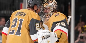 Vegas Golden Knights center Brett Howden, left, and goaltender Carter Hart congratulate each other after the Golden Knights defeated the against the Colorado Avalanche in Game 3 of the Western Conference finals NHL hockey Stanley Cup playoff series Sunday, May 24, 2026, in Las Vegas. (AP Photo/Mark J. Terrill)