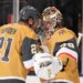 Vegas Golden Knights center Brett Howden, left, and goaltender Carter Hart congratulate each other after the Golden Knights defeated the against the Colorado Avalanche in Game 3 of the Western Conference finals NHL hockey Stanley Cup playoff series Sunday, May 24, 2026, in Las Vegas. (AP Photo/Mark J. Terrill)