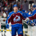 Colorado Avalanche player Martin Necas (88) celebrating a goal with his teammates during a game.