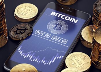 Illustration of a smartphone displaying a Bitcoin trading app with buy/sell options and a price chart, surrounded by stacks of golden Bitcoin coins.