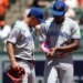 Toronto Blue Jays players Jesus Sanchez and Andres Gimenez speak on the field.