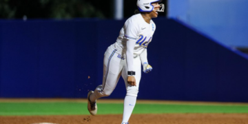 Freshman Jolyna Lamar celebrates as she rounds the bases after belting the game-tying two-run homer in the seventh inning of UCLA's 12-11 win over Cal Baptist in their NCAA Tournament opener on May 15, 2026 in Los Angeles.