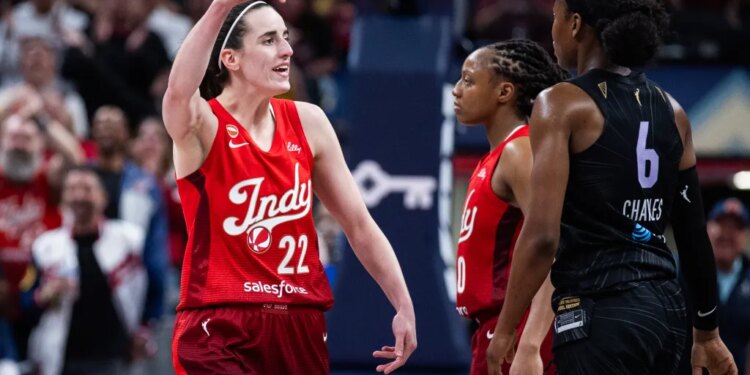 Indiana Fever guard Caitlin Clark (22) celebrates a made shot.