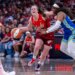 Caitlin Clark (22) reacting to contact from Arike Ogunbowale (24) during a WNBA game.