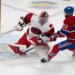 Carolina Hurricanes goalie Frederik Andersen makes a save against Montreal Canadiens' Noah Dobson during an NHL game.