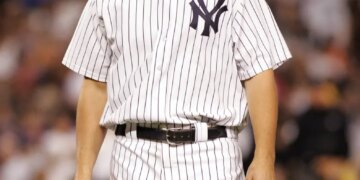 Yankees starting pitcher Carl Pavano walks off the mound after he was taken out of the game in the 6th inning.