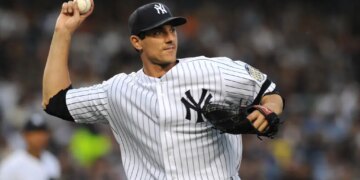 Yankees pitcher Carl Pavano attempts a pick off.