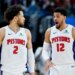 Cade Cunningham and Tobias Harris in Pistons jerseys on the court.