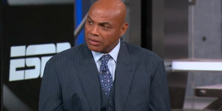 Charles Barkley in a pinstripe suit and tie, looking slightly to the right.