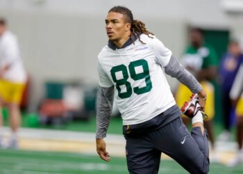 Green Bay Packers' Chase Claypool (89) stretching during rookie minicamp.