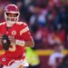 Kansas City Chiefs quarterback Patrick Mahomes looks to pass during the first half of an NFL football game against the Los Angeles Chargers, Dec. 14, 2025, in Kansas City, Mo.