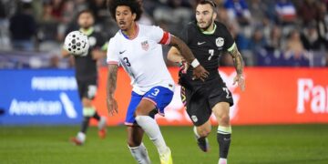 United States defender Chris Richards pursuing the ball with Australia forward Nicholas D'Agostino.