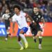 United States defender Chris Richards pursuing the ball with Australia forward Nicholas D'Agostino.