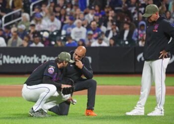 New York Mets pitcher Clay Holmes (35) has a trainer look at him during the fourth inning when the New York Mets played the New York Yankees Friday, May 15, 2026 at Citi Field in Queens, NY.